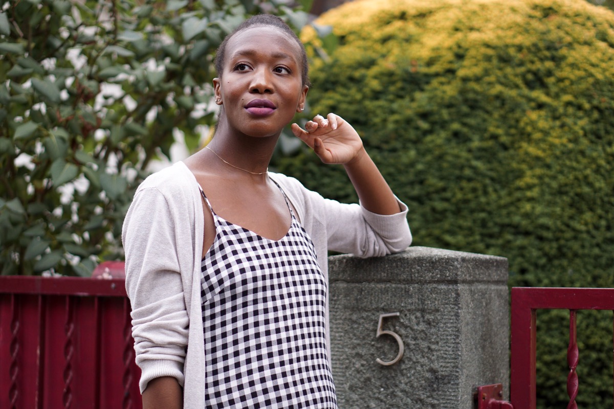 Jey in checkered midi dress